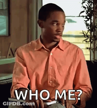 Man In Pink Shirt Holding Book Asking Who Me? GIF