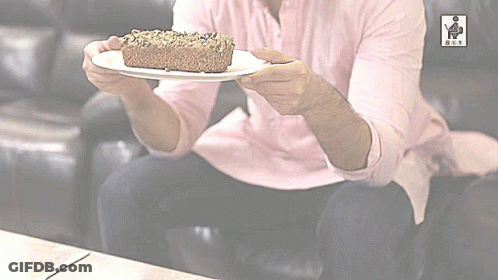 Man In Pink Shirt Holding Cake GIF