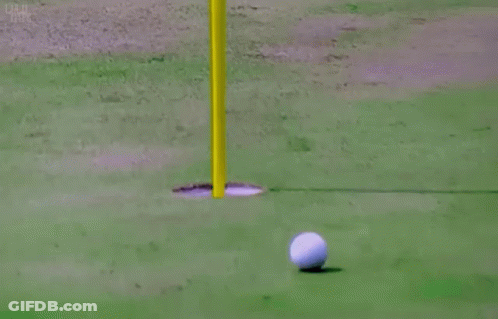 Man In Pink Shirt Holding Golf Ball GIF