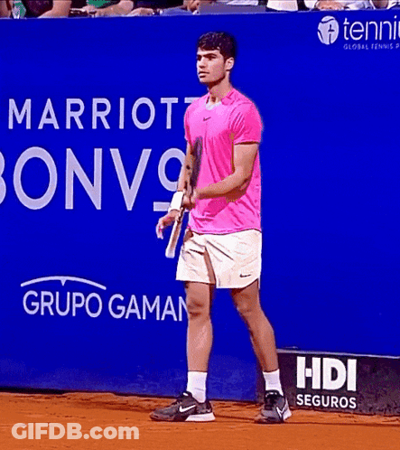 Man In Pink Shirt Holding Tennis Racquet In Front Of Marriott Bonvoy Sign GIF