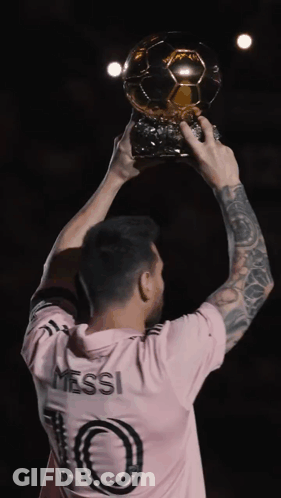 Man In Pink Shirt Holding Trophy GIF
