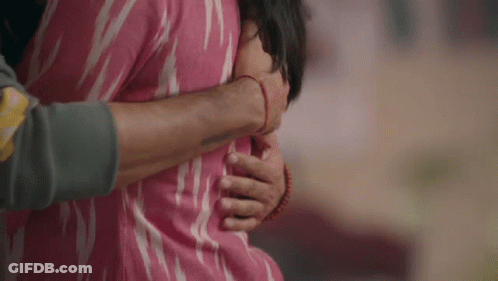 Man In Pink Shirt Hugging Woman In Pink Shirt GIF