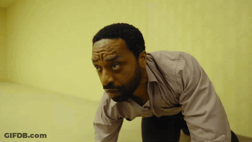 Man In Pink Shirt Kneeling GIF