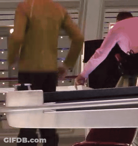 Man In Pink Shirt Next To Woman In Brown Jacket GIF