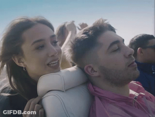 Man In Pink Shirt Next To Woman GIF