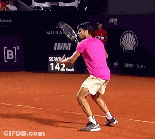 Man In Pink Shirt Playing Tennis GIF