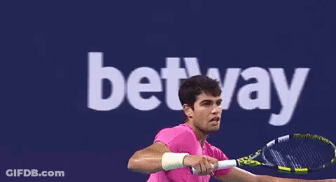 Man In Pink Shirt Playing Tennis Betway GIF