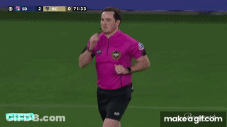Man In Pink Shirt Running On Soccer Field GIF