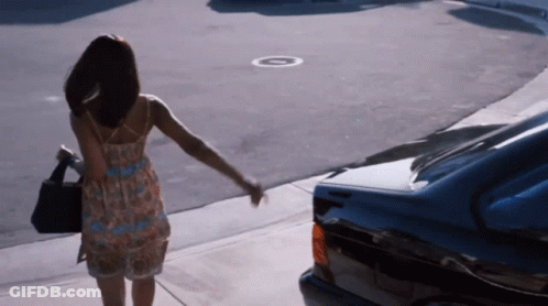 Man In Pink Shirt Running With Woman In Black Sweater GIF