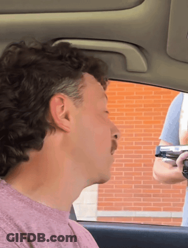 Man In Pink Shirt Sitting In Car GIF