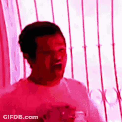 Man In Pink Shirt Standing GIF