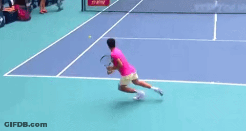 Man In Pink Shirt Stretching Legs On Court GIF