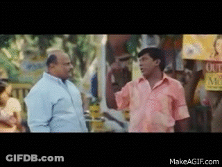 Man In Pink Shirt Talking To Man In Blue GIF