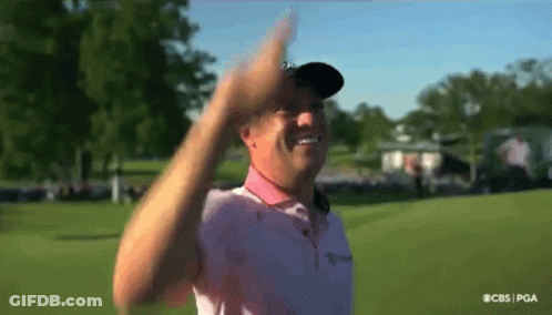 Man In Pink Shirt Waving GIF
