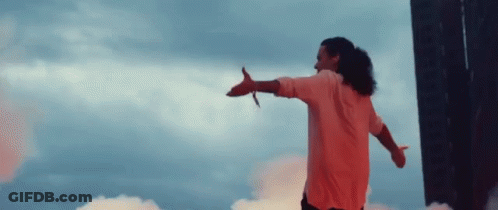 Man In Pink Shirt With Arms Outstretched GIF