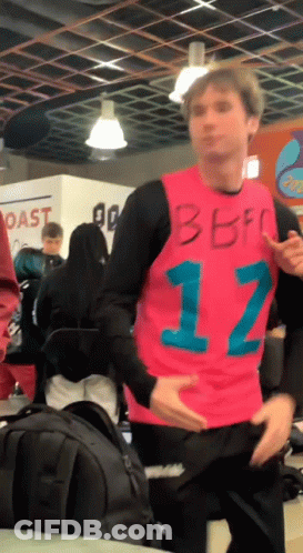 Man In Pink Shirt With Number 12 GIF