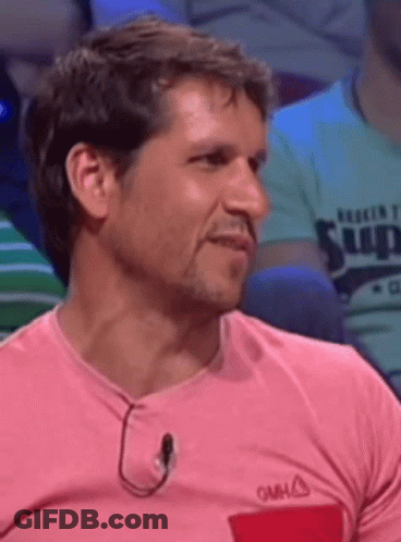 Man In Pink Shirt With Red Pocket And Neck Microphone GIF