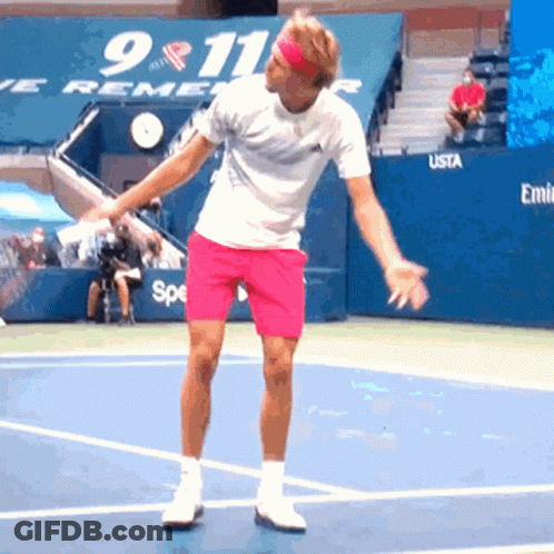 Man In Pink Shorts Playing Tennis 911 Sign GIF