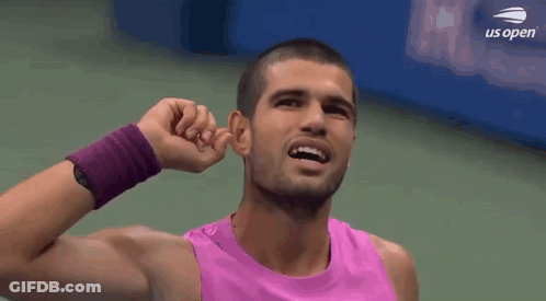 Man In Pink Tank Top Covering Ears GIF