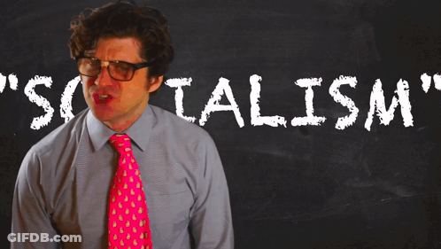 Man In Pink Tie At Blackboard Socialism GIF