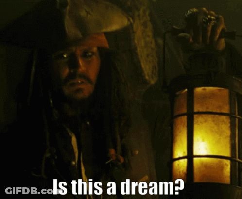 Man In Pirate Hat Holding Lantern Says Is This A Dream GIF