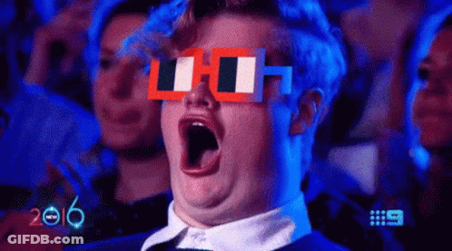 Man In Pixelated Glasses Yawning In Crowd GIF