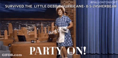 Man In Plaid Dress Standing By Party Desk GIF