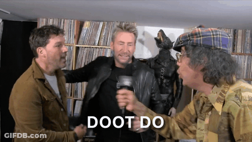 Man In Plaid Hat Holding Mic With Doot Do GIF