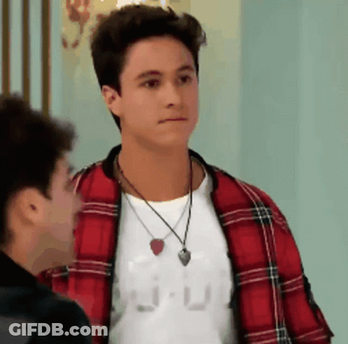 Man In Plaid Jacket And Necklace Beside Another Man GIF