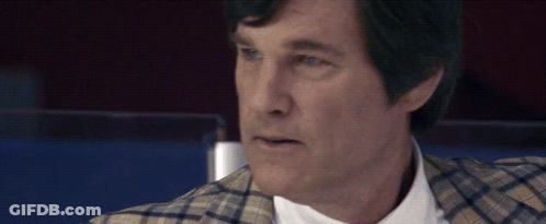 Man In Plaid Jacket And White Shirt Looking At Camera GIF