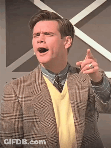 Man In Plaid Jacket And Yellow Sweater Pointing GIF