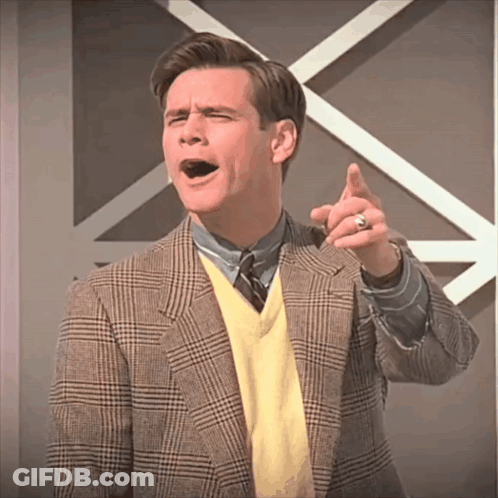Man In Plaid Jacket And Yellow Sweater Pointing GIF