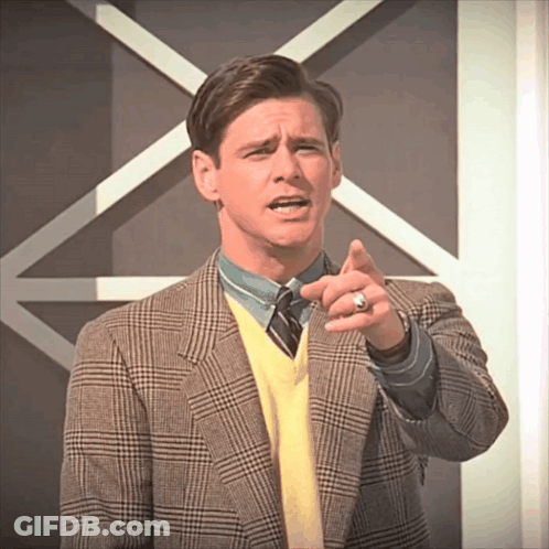 Man In Plaid Jacket And Yellow Sweater Pointing GIF
