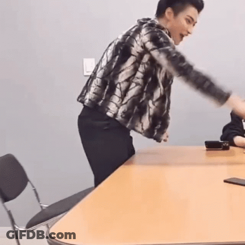 Man In Plaid Jacket With Arms Outstretched GIF