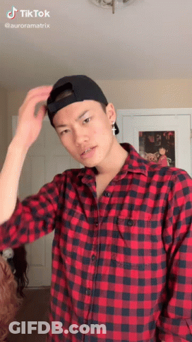 Man In Plaid Shirt And Baseball Cap GIF