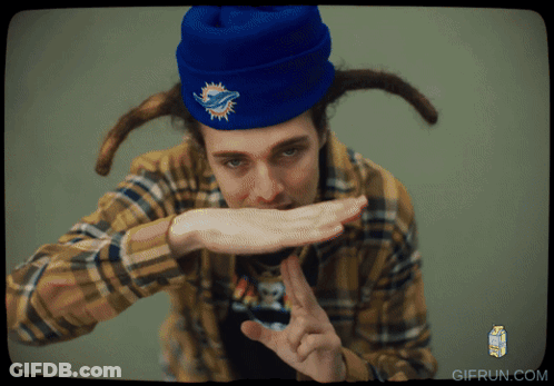 Man In Plaid Shirt And Blue Beanie With Dolphins Logo GIF