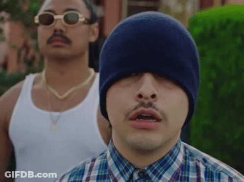 Man In Plaid Shirt And Blue Hat Next To Sunglasses GIF