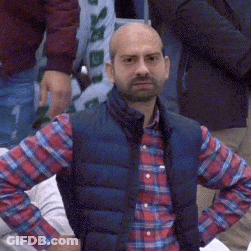 Man In Plaid Shirt And Blue Vest GIF