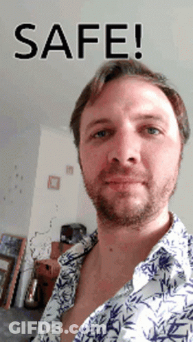 Man In Plaid Shirt And Cowboy Hat At 40 Sign GIF