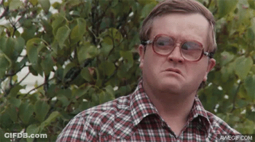 Man In Plaid Shirt And Glasses By Bush GIF