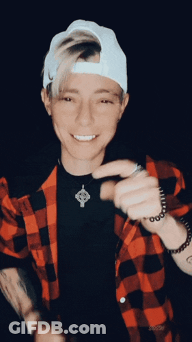 Man In Plaid Shirt And Hat Smiling GIF