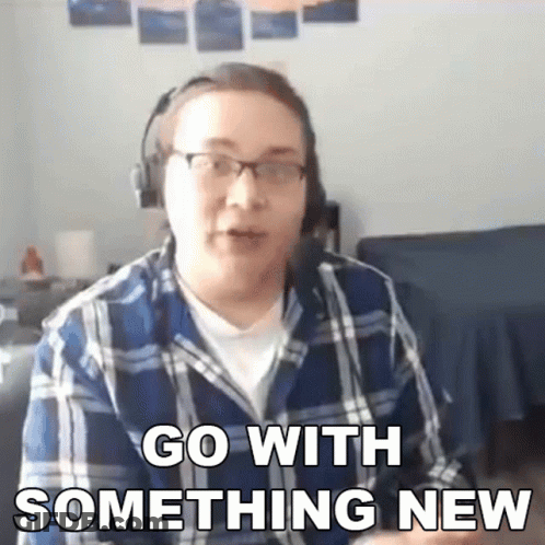 Man In Plaid Shirt And Headphones Says Go With Something New GIF