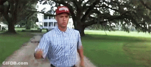 Man In Plaid Shirt And Red Hat Running GIF
