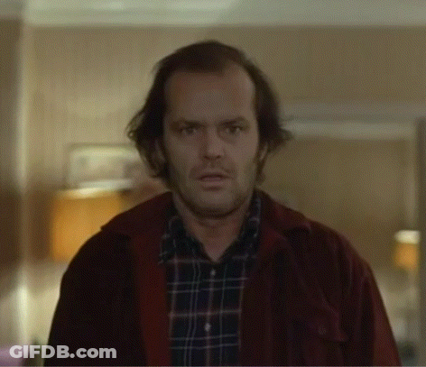 Man In Plaid Shirt And Red Jacket Looking At Camera GIF