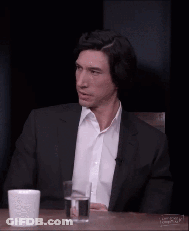 Man In Plaid Shirt And Suspenders Looking Over Shoulder GIF