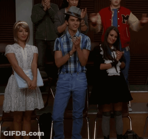 Man In Plaid Shirt And Suspenders With Two Women GIF