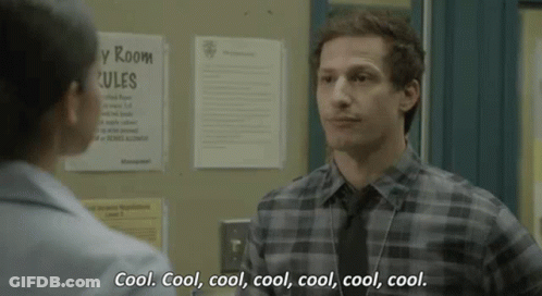 Man In Plaid Shirt And Tie Talking To Woman In Hallway GIF
