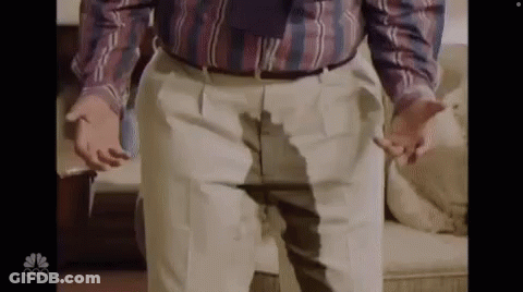 Man In Plaid Shirt And Tie With Wet Pants GIF