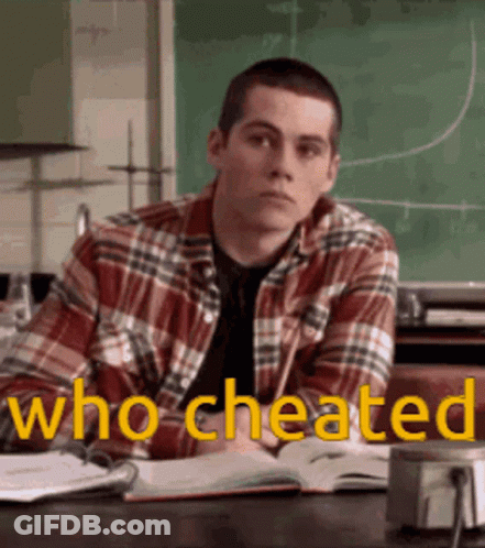 Man In Plaid Shirt At Desk With Chalkboard Saying Who Cheated GIF