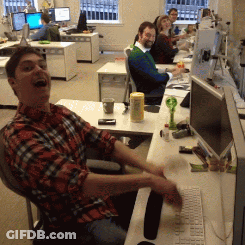 Man In Plaid Shirt At Desk With Computer Monitor GIF